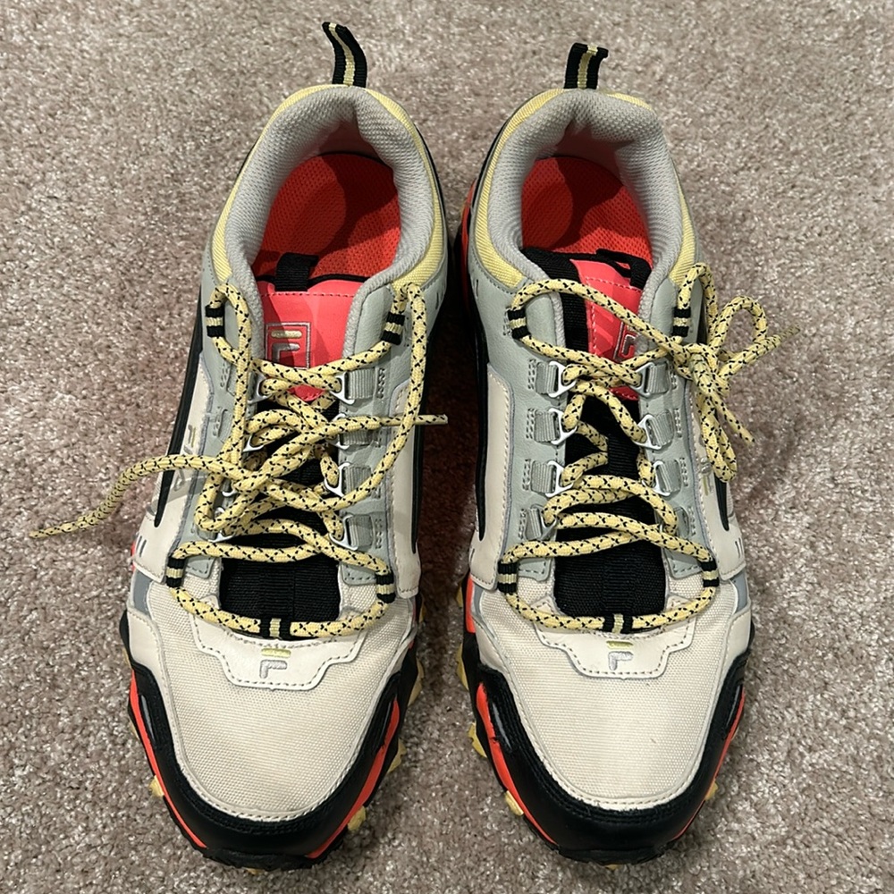 Women’s orange, yellow, and white Fila sneakers